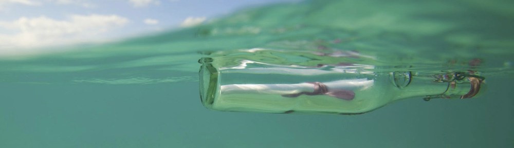 message in a bottle floating in the water